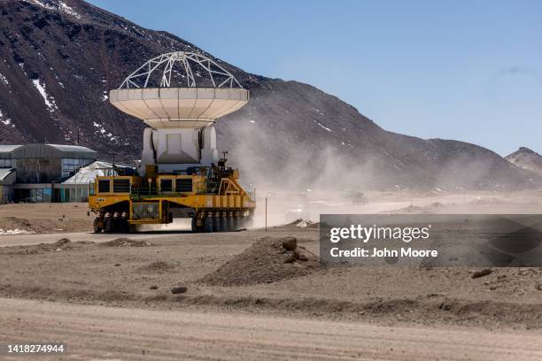 Massive antenna, part of the Atacama Large Millimeter/submillimeter Array radio telescope, is moved into position on August 26, 2022 on the...