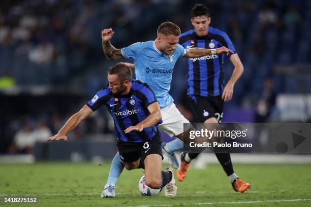 Ciro Immobile of SS Lazio is tackled by Stefan de Vrij of FC Internazionale during the Serie A match between SS Lazio and FC Internazionale at Stadio...