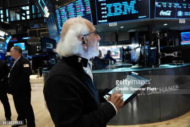 Stock trader Peter Tuchman work on the floor of the New York Stock Exchange on August 26, 2022 in New York City. The Dow Jones Industrial Average...