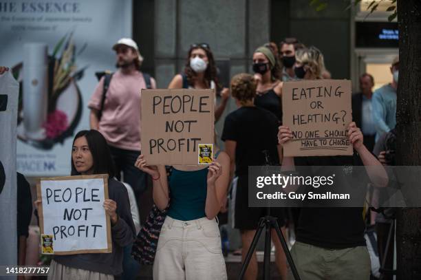 Activists attend a protest called by Don't Pay UK protest outside Ofgem at Canary Wharf on August 26, 2022 in London, England. Ofgem announced the...