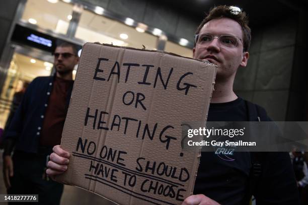 Activists attend a protest called by Don't Pay UK protest outside Ofgem at Canary Wharf on August 26, 2022 in London, England. Ofgem announced the...