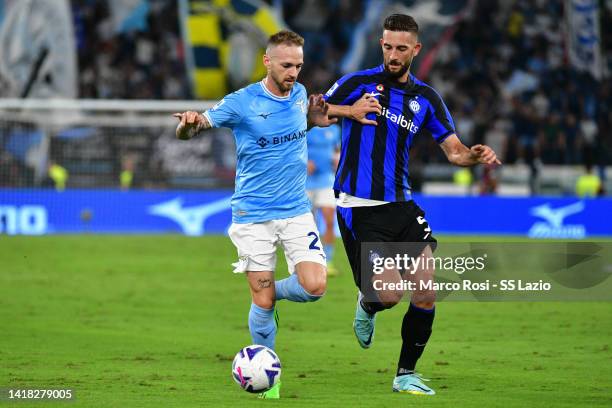 Manuel Lazzari of SS Lazio compete for the ball with Roberto Gagliardi of FC Internazionale during the Serie A match between SS Lazio and FC...