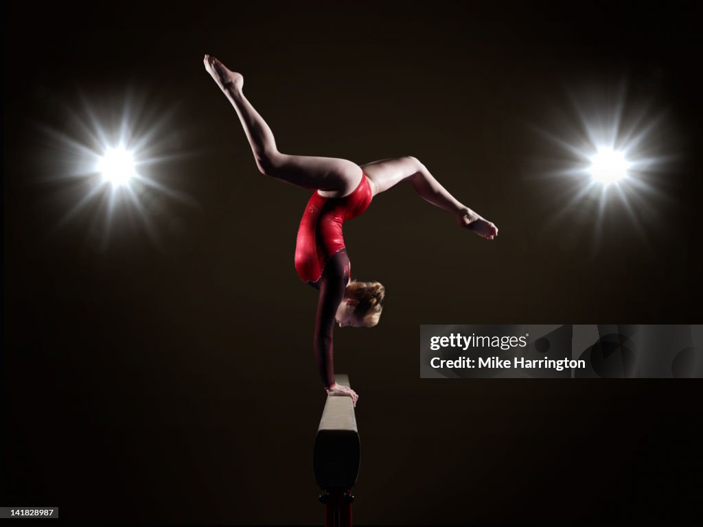 Female Gymnast on Balancing Beam.