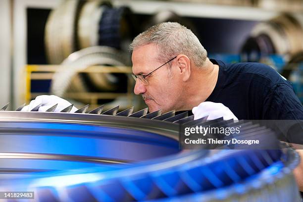 aerospace technician working in factory - aviation worker stockfoto's en -beelden