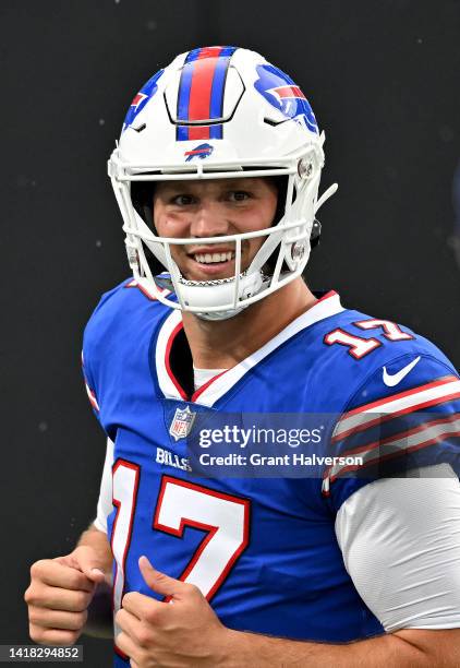 Josh Allen of the Buffalo Bills smiles during warmups before a preseason game against the Carolina Panthers at Bank of America Stadium on August 26,...