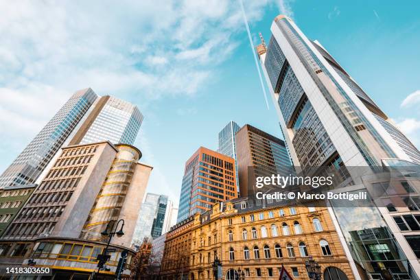 low angle view of modern skyscrapers in central frankfurt, germany - building low angle stockfoto's en -beelden