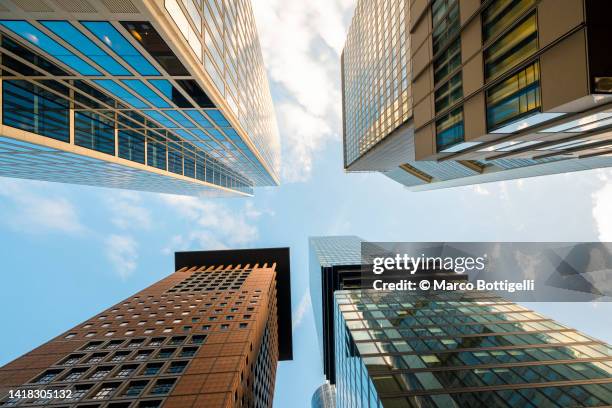 low angle view of modern skyscrapers, frankfurt, germany - zentralbank stock-fotos und bilder