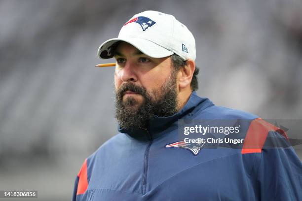 Senior football advisor Matt Patricia of the New England Patriots walks onto the field during warmups before a preseason game against the Las Vegas...