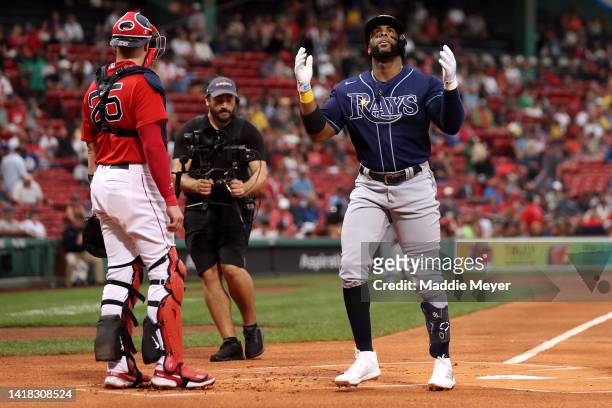 Yandy Diaz of the Tampa Bay Rays celebrates after hitting a home run against the Boston Red Sox during the first inning at Fenway Park on August 26,...