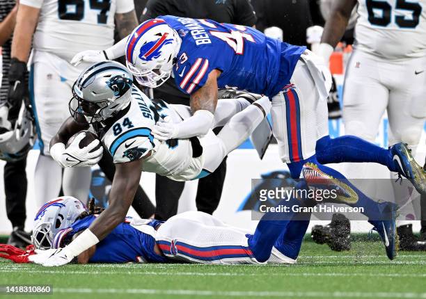 Terrel Bernard of the Buffalo Bills tackles Stephen Sullivan of the Carolina Panthers after a catch during the first quarter of a preseason game at...
