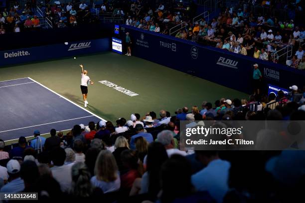 Adrian Mannarino of France serves to Botic van de Zandschulp of Netherlands during their semi-finals match on day seven of the Winston-Salem Open at...