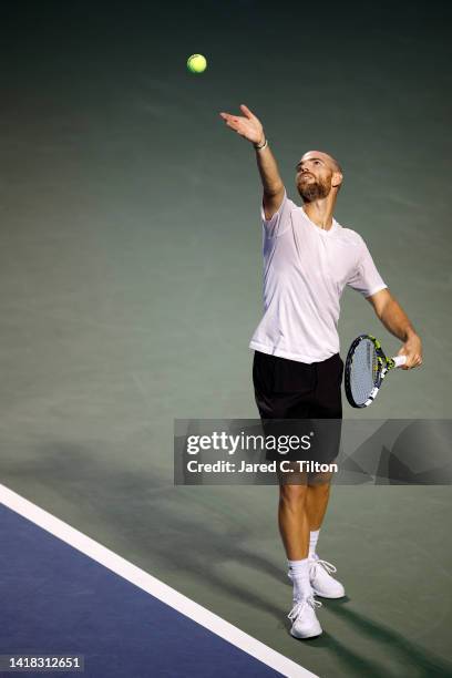 Adrian Mannarino of France serves to Botic van de Zandschulp of Netherlands during their semi-finals match on day seven of the Winston-Salem Open at...