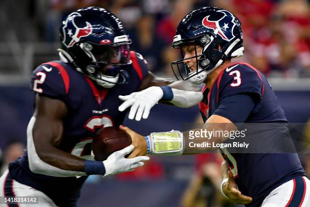 Kyle Allen hands the ball off to Marlon Mack of the Houston Texans during a preseason game against the San Francisco 49ers at NRG Stadium on August...