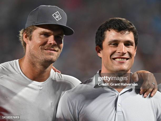 Former Carolina Panthers Gregg Olsen, left, and Luke Kuechley watches his team play against the Buffalo Bills during the second quarter of a...