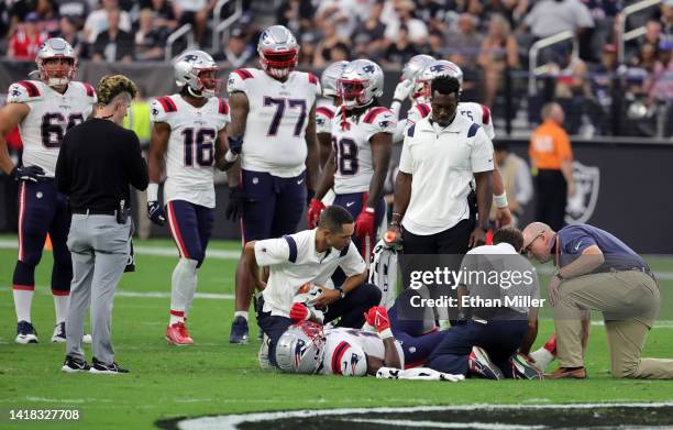 Players look on as wide receiver Ty Montgomery of the New England Patriots is tended to on the field after he was injured on a play against the Las...