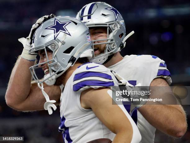 Wide receiver Simi Fehoko of the Dallas Cowboys celebrates with offensive tackle Josh Ball of the Dallas Cowboys after scoring a touchdown against...