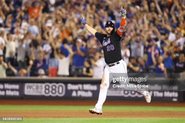 Pete Alonso of the New York Mets hits a walk-off single in the bottom of the ninth inning to defeat the Colorado Rockies 7-6 at Citi Field on August...