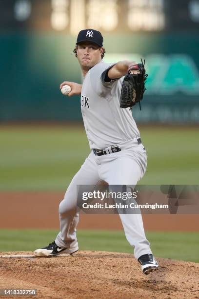 Gerrit Cole of the New York Yankees pitches in the bottom of the second inning against the Oakland Athletics at RingCentral Coliseum on August 26,...
