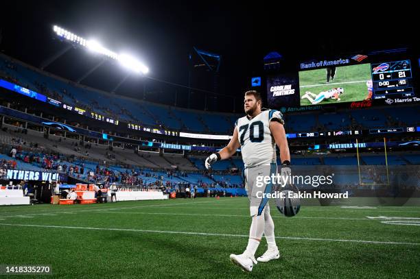 Brady Christensen of the Carolina Panthers walks off the field after a preseason game against the Buffalo Bills at Bank of America Stadium on August...