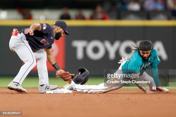 Amed Rosario of the Cleveland Guardians tags out J.P. Crawford of the Seattle Mariners during the third inning of their game at T-Mobile Park on...