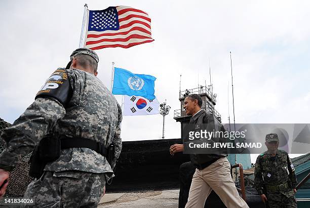 President Barack Obama arrives to look towards North Korea from from Observation Post Ouellette during a visit to the Joint Security Area of the...