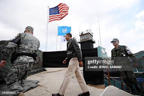 President Barack Obama arrives to look towards North Korea from from Observation Post Ouellette during a visit to the Joint Security Area of the...