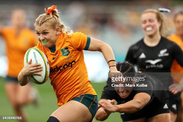 Georgina Friedrichs of the Wallaroos makes a break during the O'Reilly Cup match between the Australian Wallaroos and the New Zealand Black Ferns at...