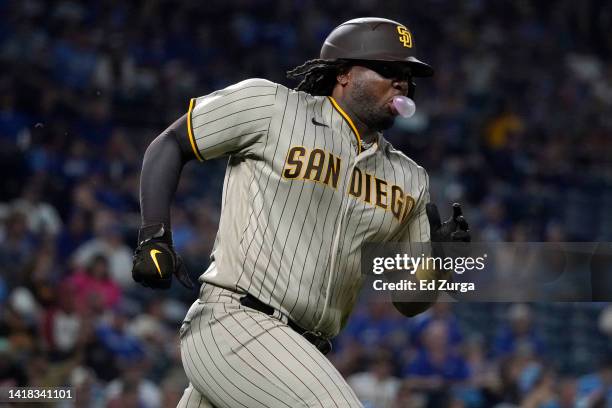 Josh Bell of the San Diego Padres runs to first after hitting a double in the seventh inning against the Kansas City Royals at Kauffman Stadium on...