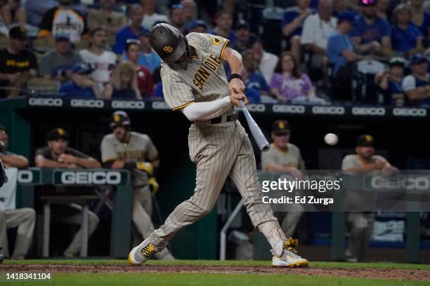 Wil Myers of the San Diego Padres hits a single in the seventh inning against the Kansas City Royals at Kauffman Stadium on August 26, 2022 in Kansas...
