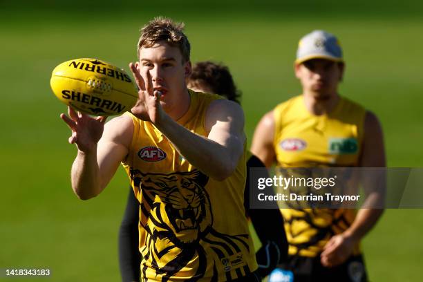 Tom J. Lynch of the Tigers gathers the ball during a Richmond Tigers AFL training session at Punt Road Oval on August 27, 2022 in Melbourne,...