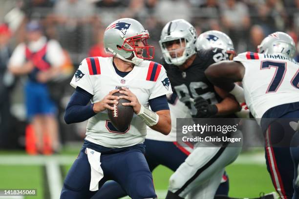 Quarterback Brian Hoyer of the New England Patriots looks to throw a pass against the Las Vegas Raiders during the first half of a preseason game at...