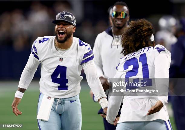 Quarterback Dak Prescott of the Dallas Cowboys celebrates with running back Ezekiel Elliott of the Dallas Cowboys after safety Juanyeh Thomas of the...