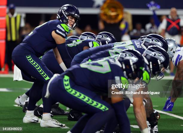 Drew Lock of the Seattle Seahawks waits for the snap against the Dallas Cowboysin an NFL preseason football game at AT&T Stadium on August 26, 2022...