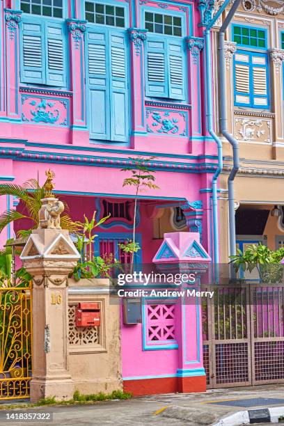 colourful pink blue decorative houses on street, singapore - andrew house stock pictures, royalty-free photos & images