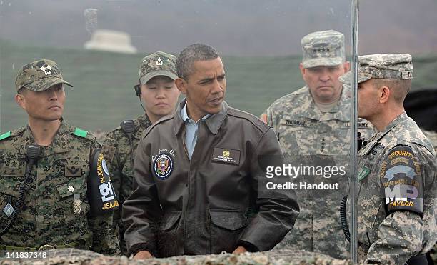 President Barack Obama meets with military personnel at the Observation Post Ouellette in the Demilitarized Zone which separates the two Koreas in...
