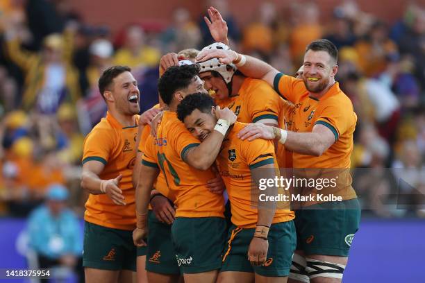 Noah Lolesio of the Wallabies celebrates with team mates after a try scored by Fraser McReight during The Rugby Championship match between the...