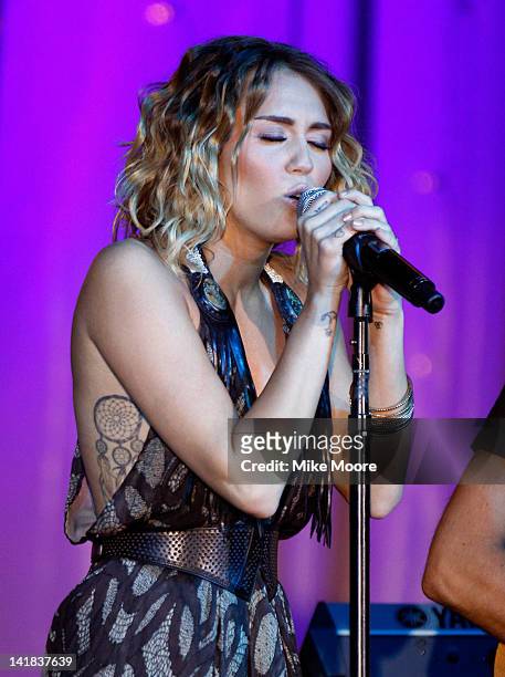 Singer/actress Miley Cyrus performs onstage during Muhammad Ali's Celebrity Fight Night XVIII held at JW Marriott Desert Ridge Resort & Spa on March...