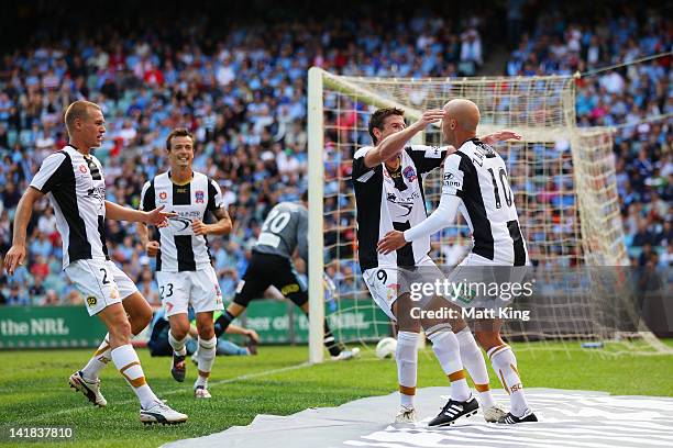 Michael Bridges celebrates with Ruben Zadkovich of the Jets after scoring a goal during the round 25 A-League match between Sydney FC and the...