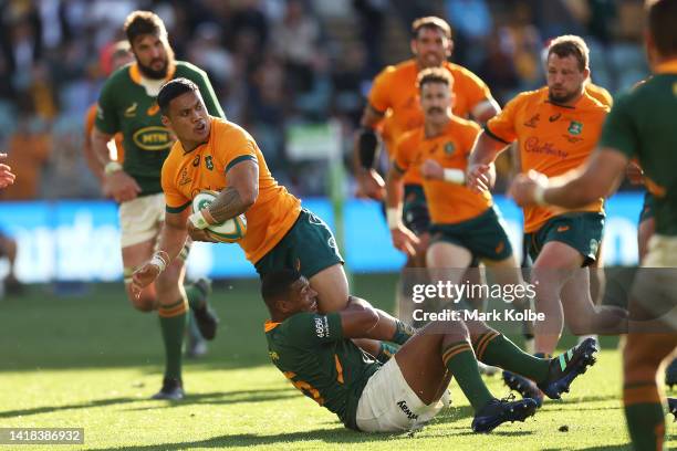 Len Ikitau of the Wallabies is tackled during The Rugby Championship match between the Australian Wallabies and the South African Springboks at...