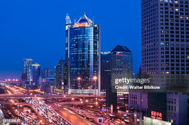 view of jianguomenwai dajie and office buildings looking east, chaoyang district, beijing - jianguomenwai fotografías e imágenes de stock