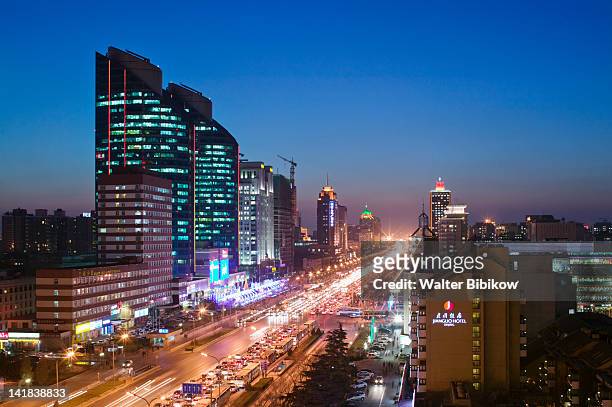 view of jianguomenwai dajie and office buildings looking east, chaoyang district, beijing - jianguomenwai stock pictures, royalty-free photos & images