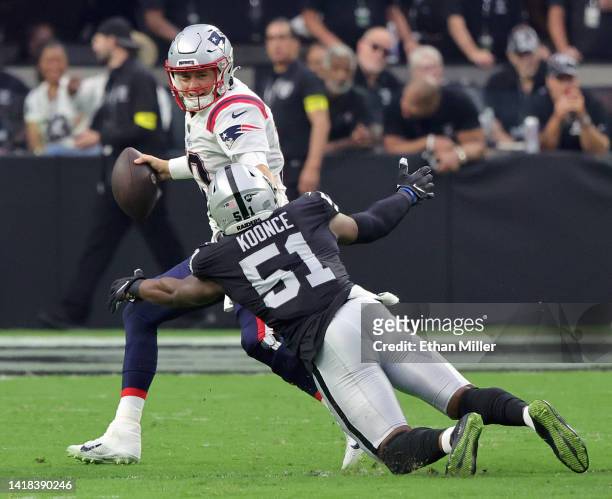 Defensive end Malcolm Koonce of the Las Vegas Raiders sacks quarterback Mac Jones of the New England Patriots during their preseason game at...