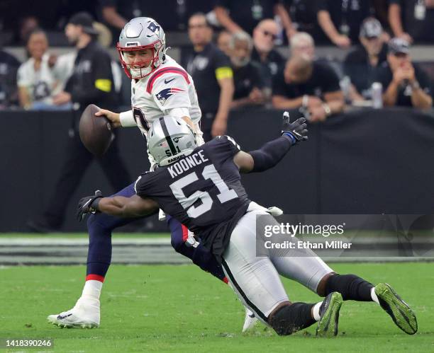 Defensive end Malcolm Koonce of the Las Vegas Raiders sacks quarterback Mac Jones of the New England Patriots during their preseason game at...