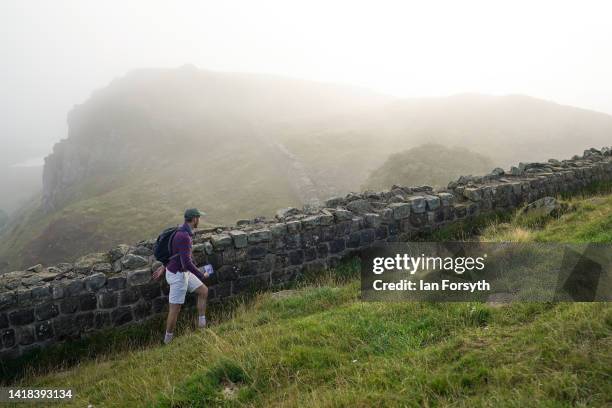 Walker makes their way along Hadrian's Wall which this year celebrates the 1900th anniversary of the beginning of the construction on August 27, 2022...