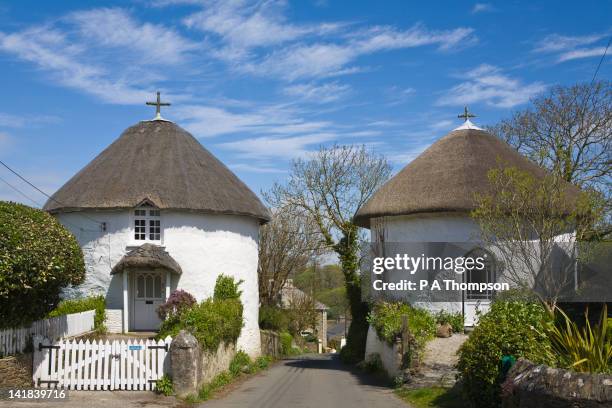 two round thatched cottage, veryan, cornwall, england - thatched roof stock pictures, royalty-free photos & images