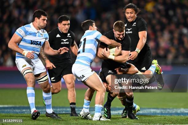 Jordie Barrett of the All Blacks is tackled during The Rugby Championship match between the New Zealand All Blacks and Argentina Pumas at...