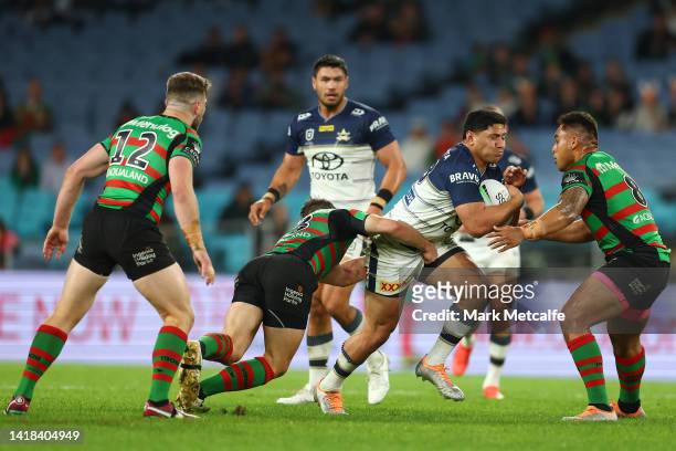 Jason Taumalolo of the Cowboys is tackled during the round 24 NRL match between the South Sydney Rabbitohs and the North Queensland Cowboys at Accor...