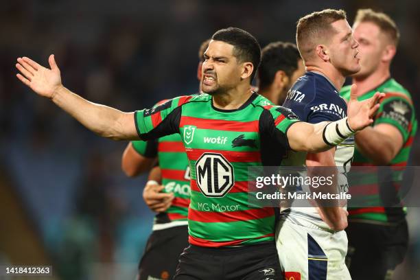 Cody Walker of the Rabbitohs celebrates a try by team mate Alex Johnston of the Rabbitohs during the round 24 NRL match between the South Sydney...