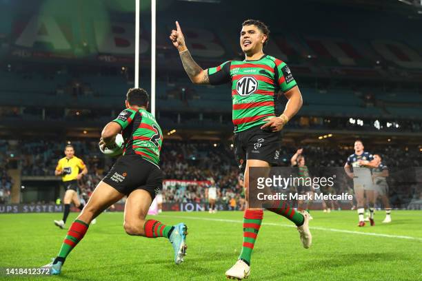 Latrell Mitchell of the Rabbitohs celebrates a try by team mate Alex Johnston of the Rabbitohs during the round 24 NRL match between the South Sydney...