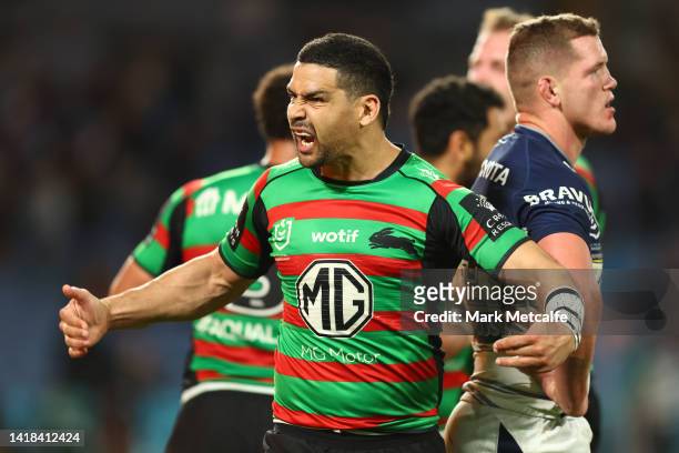 Cody Walker of the Rabbitohs celebrates a try by team mate Alex Johnston of the Rabbitohs during the round 24 NRL match between the South Sydney...